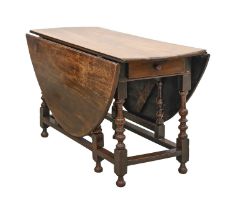 An oak gateleg table, 18th c, 71cm h; 128 x 155cm Some alteration faults and repair