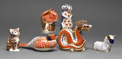Six Royal Crown Derby paperweights, including a dragon, various sizes, printed mark and gilt stopper