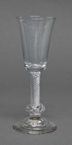 A George II ale glass, the rounded funnel bowl on multiple spiral air twist stem with basal knop and