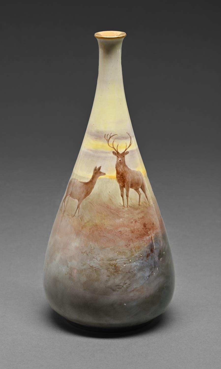 A Royal Doulton Luscian Ware vase, c1900, painted by J Hancock, signed, with a stag and doe in a