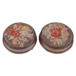 A pair of Victorian inlaid mahogany foot stools, with woolwork top, 29cm diam