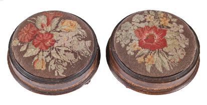 A pair of Victorian inlaid mahogany foot stools, with woolwork top, 29cm diam