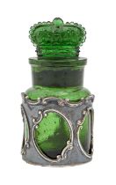 An Edwardian pierced silver bottle sleeve and contemporary moulded green glass bottle and crown