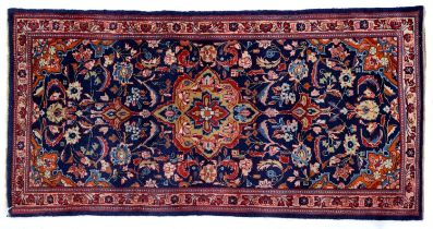 A Persian Kashan rug, 126 x 64cm