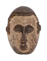 Tribal art. West Africa - an Igbo carved wood face mask, mid 20th c, 35cm Numerous minor scuffs