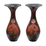 A pair of Japanese lacquered porcelain vases, Meiji period, the fenestrated black, red and gold