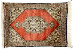 A Persian Ghom silk rug, 81 x 55cm