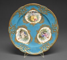 A Sevres plate, 18th c, the decoration later, painted with three reserves of figures in cisele
