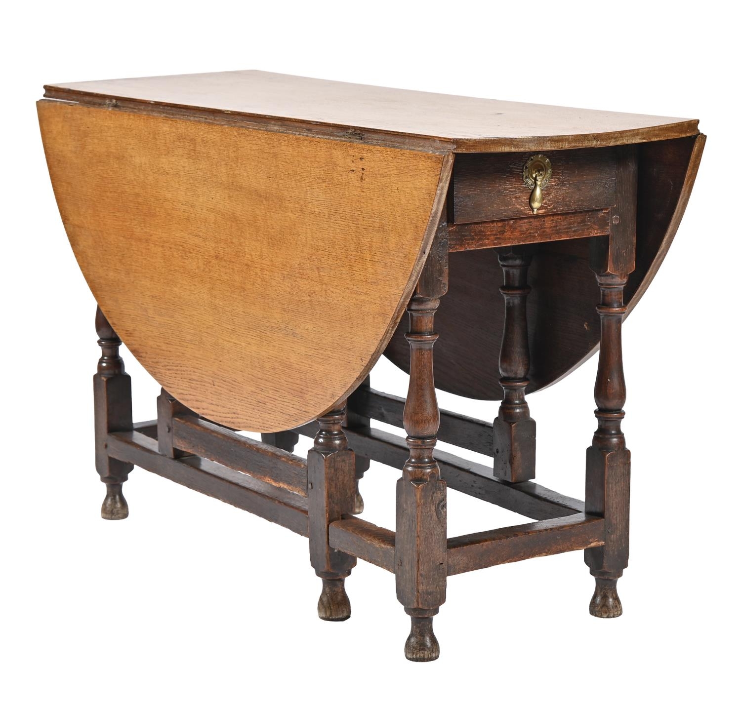 An oak gateleg table, 18th c, with associated light oak top, 73cm h; 119 x 132cm Serviceable
