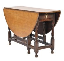 An oak gateleg table, 18th c, with associated light oak top, 73cm h; 119 x 132cm Serviceable
