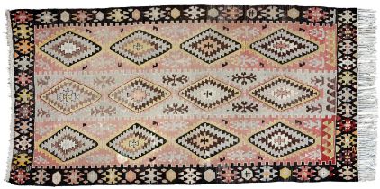 A rug, probably Turkish or North African, 19th/20th c, 780 x 415cn Typical country house