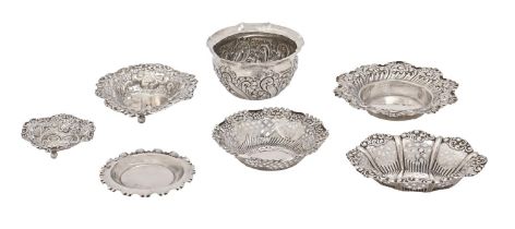 Six late Victorian and Edwardian die stamped silver bonbon dishes and a cache pot, various sizes,