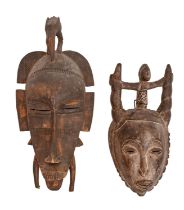 Tribal art. West Africa - a Senufo Kpelie carved wood mask, 47cm and a Yaoure carved wood mask,