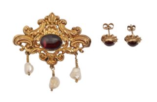 An early Victorian garnet, baroque pearl and gold brooch, 46mm h and a pair of garnet cabochon ear