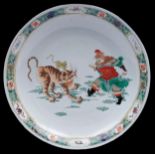 A Chinese famille verte dish, 19th c, enamelled with a ferocious tiger and equally ferocious man,