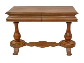 A Victorian mahogany library table, c. 1860, slightly oversailing moulded top above two frieze