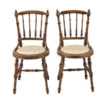 A pair of turned beech chairs, late 19th c, with padded circular seat Both sound