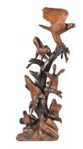 An unusually large carved and stained wood Swiss style 'Black Forest' carving of birds in a tree,