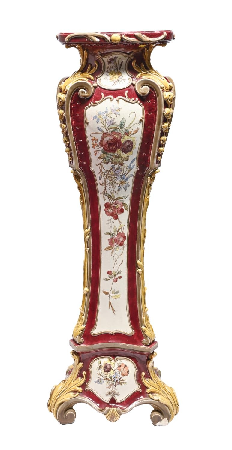 A Continental majolica torchere or pedestal, c1900, printed and painted with flowers reserved on a