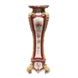 A Continental majolica torchere or pedestal, c1900, printed and painted with flowers reserved on a