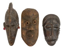 Tribal art. West Africa - a carved wood bambara marka face mask, 39cm and a baule portrait mask,