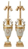 A pair of Continental partly biscuit gilt porcelain vases, late 20th c, in Empire style, on