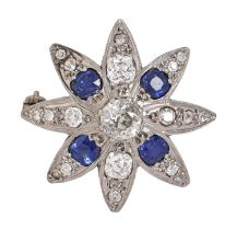 A sapphire and diamond brooch, in the form of a flower with cushion shaped old cut diamonds and four