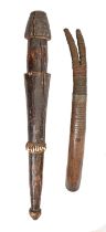 Tribal art. Central Africa - a carved wood club, decorated with a band of cowry shells, 62cm l and a