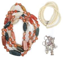 A cultured pearl twin row necklace, a silver charm bracelet and a polished pebble bracelet