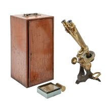 A brass and iron binocular microscope, Watson & Son 313 High Holborn London 1031, with accessories