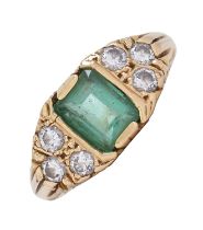 An emerald and diamond ring, the step cut emerald approximately 5 x 7mm, between triple diamond