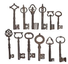 Twelve iron door keys, Victorian and later, including gothic and other ornamental styles and several