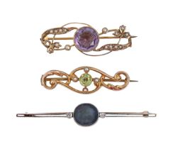 A peridot and seed pearl brooch, in 15ct gold, 37mm l, Chester 1911, 2.2g, a black opal diamond
