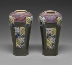 A pair of Doulton Ware vases, early 20th c, decorated with panels of stylised flowers beneath high