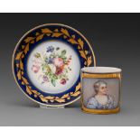 A French porcelain coffee can and a saucer, early 20th c, painted with a portrait of a young