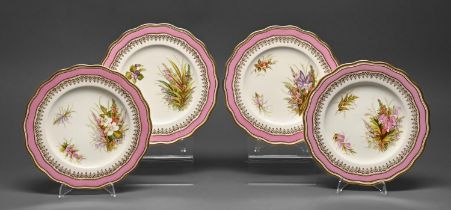 A set of four English porcelain shaped circular dessert plates, dated 1868, painted with sprigs of