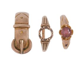 A 9ct gold buckle ring, Birmingham 1920, size U and two other 9ct gold rings, one gem set, 11.5g (3)