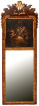A parcel gilt walnut mirror, early 20th c, painted with putti in clouds, 120 x 42cm Paint chipped