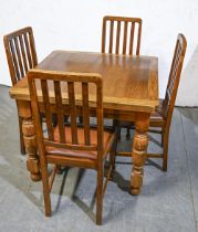 An oak draw leaf dining table, on turned legs and a set of four oak dining chairs, c1930s, table