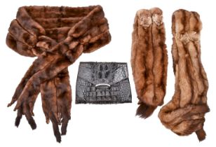 Vintage clothing. A fur coat, three fur stoles and a contemporary crocodile hide clutch bag