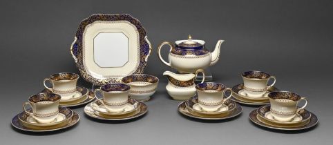An Aynsley tea service, c1930, with cobalt and gilt border, two handled plate 25.5cm w, printed mark