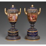 A pair of Vienna style vases, pedestals and covers, c1900, painted by C Heer, one signed, with
