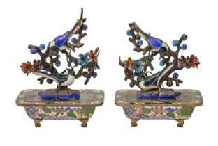 A pair of Japanese miniature giltmetal and enamel birds in bonsai, 20th c, 95mm h In substantially