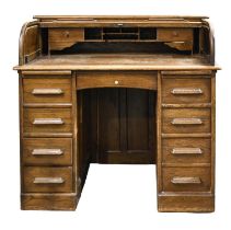 An oak pedestal desk, with fitted interior and tambour shutter, bearing trade label for Dawson &