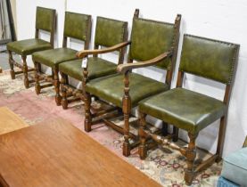 A set of five oak dining chairs, covered in green leather, including an elbow chair