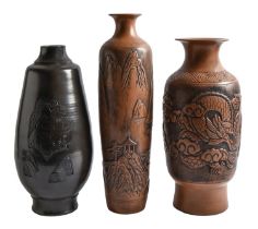 Three earthenware vases, decorated with oriental designs, 51cm h and smaller