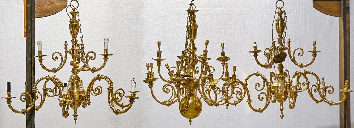 A pair of Victorian style nine branch brass chandeliers and another similar, 95cm w x 85cm h and