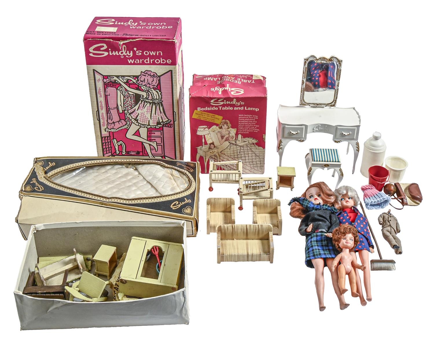 A quantity of dolls and doll's house furniture, including Sindy bedroom furniture, boxed