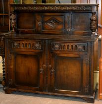 A carved and stained oak livery cupboard, in 17th c style, 138cm h; 64 x 137cm