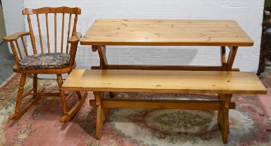 A pine kitchen table, 73cm h; 122 x 68cm, a pine bench, 140cm l and a rocking chair